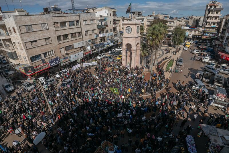 Hundreds of Syrians gather near Clock Square in Idlib. Outright fighting between the government and opposition groups has dropped in intensity, the conflict is far from over