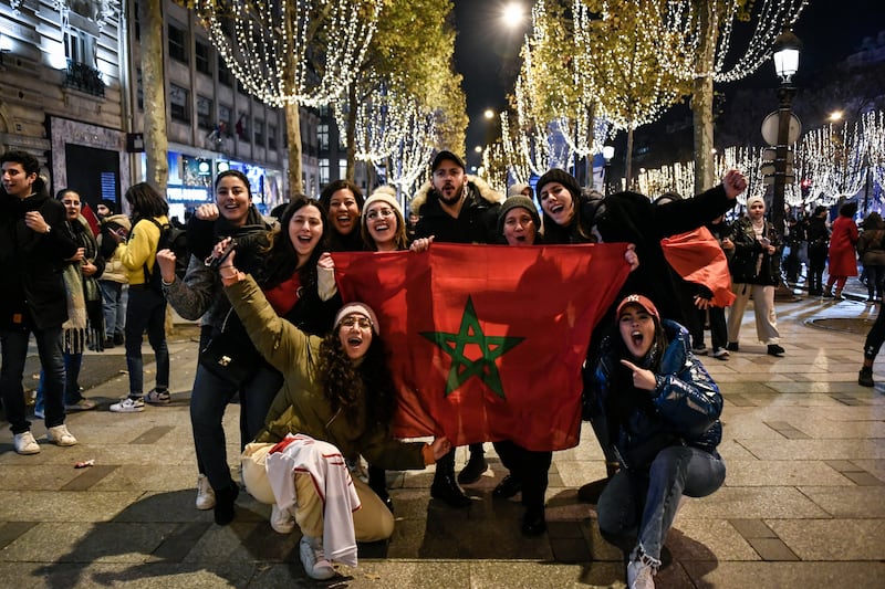 Fans also took to the famous Paris avenue after Morocco's last 16 victory over Spain. AFP