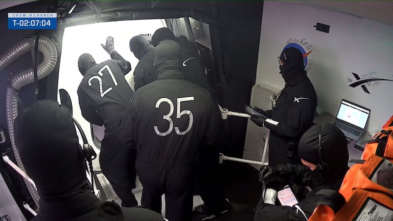 The engineering staff seal the cabin door before launch