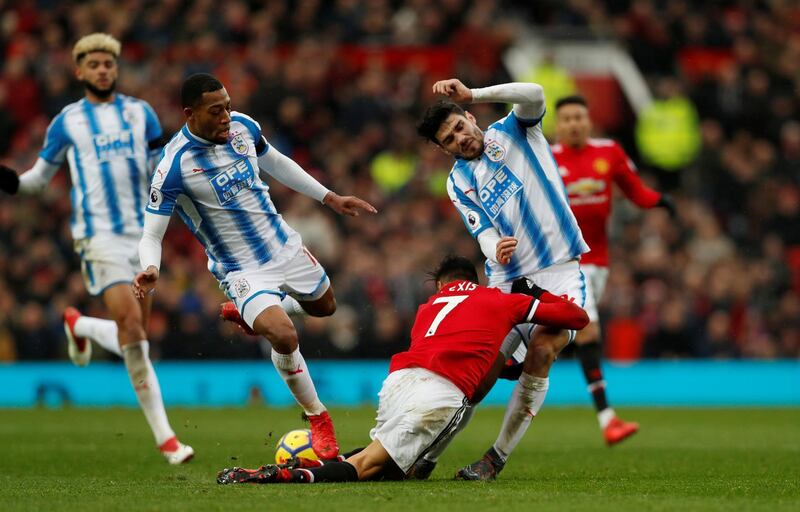 Soccer Football - Premier League - Manchester United vs Huddersfield Town - Old Trafford, Manchester, Britain - February 3, 2018   Manchester United’s Alexis Sanchez in action with Huddersfield Town’s Christopher Schindler    Action Images via Reuters/Lee Smith    EDITORIAL USE ONLY. No use with unauthorized audio, video, data, fixture lists, club/league logos or "live" services. Online in-match use limited to 75 images, no video emulation. No use in betting, games or single club/league/player publications.  Please contact your account representative for further details.     TPX IMAGES OF THE DAY