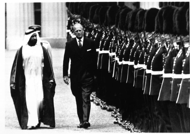 Sheik Khalifa bin Zayed Al Nahyan, President of the United Arab Emirates is accompanied by Prince Philip, the Duke of Edinburgh as he receives the Guard of Honour at Buckingham Palace, London on July 17, 1989. (AP Photo/WPA POOL)