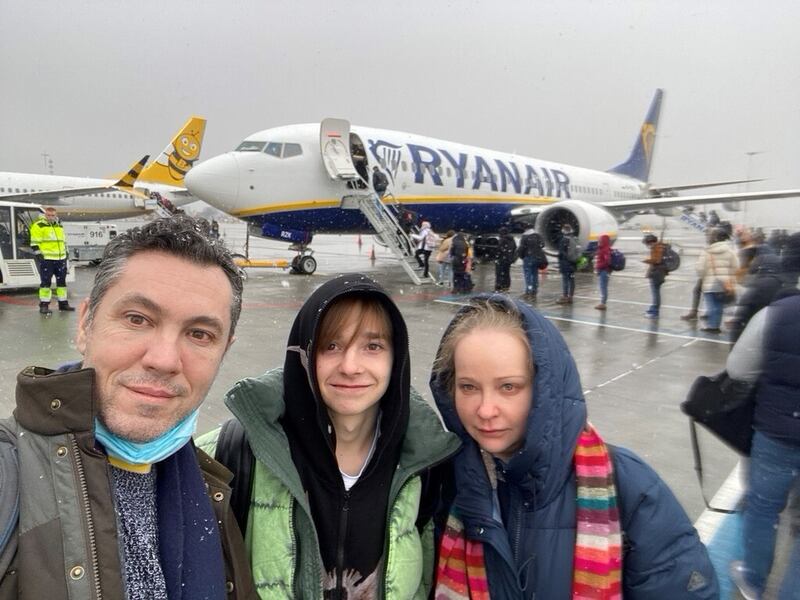 Dr Anton Enright, left, with his nephew Viktor, centre, and his girlfriend Tatyana Lapa. The three flew from Poland to Dublin and are waiting on a British visa for Viktor. Photo: Anton Enright