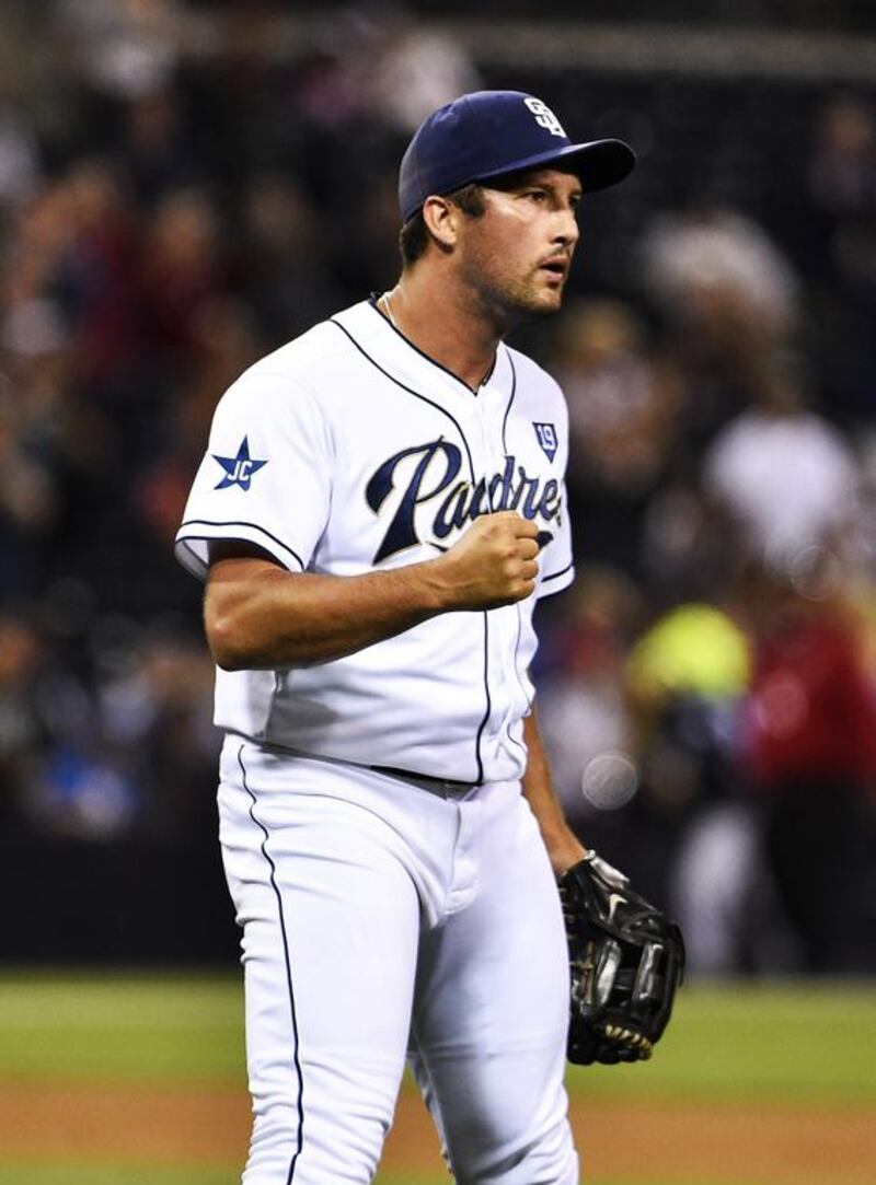 Huston Street of the San Diego Padres pumps his fist after getting the final out during the ninth inning against the Cincinnati Reds at Petco Park on June 30, 2014, in San Diego, California. Denis Poroy / Getty Images