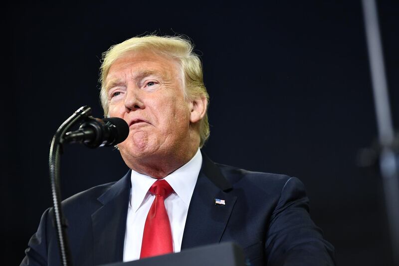 (FILES) In this file photo taken on August 30, 2018 US President Donald Trump speaks during a campaign rally at Ford Center in Evansville, Indiana. - President Donald Trump responded September 5, 2018 to a damning book about his presidency by journalist Bob Woodward by suggesting that Congress change US libel laws."Isn't it a shame that someone can write an article or book, totally make up stories and form a picture of a person that is literally the exact opposite of the fact, and get away with it without retribution or cost," Trump tweeted."Don't know why Washington politicians don't change libel laws?"The tweet was Trump's latest reaction to "Fear," Woodward's account of a "crazytown" White House in the grip of an angry, unhinged president whose aides scurry to keep him from blundering into war and other disasters. (Photo by MANDEL NGAN / AFP)