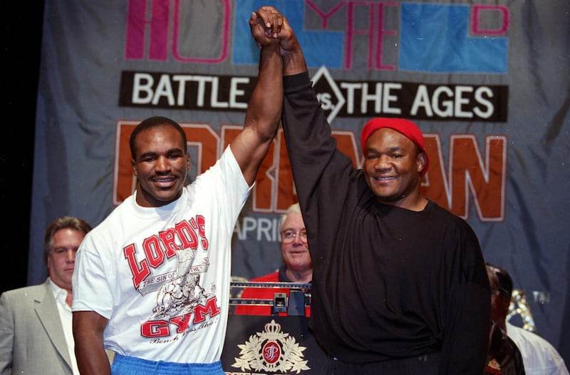 19 Apr 1991:  Evander Holyfield stands with George Foreman before the fight in Atlantic City, New Jersey. Mandatory Credit: Rick Stewart  /Allsport