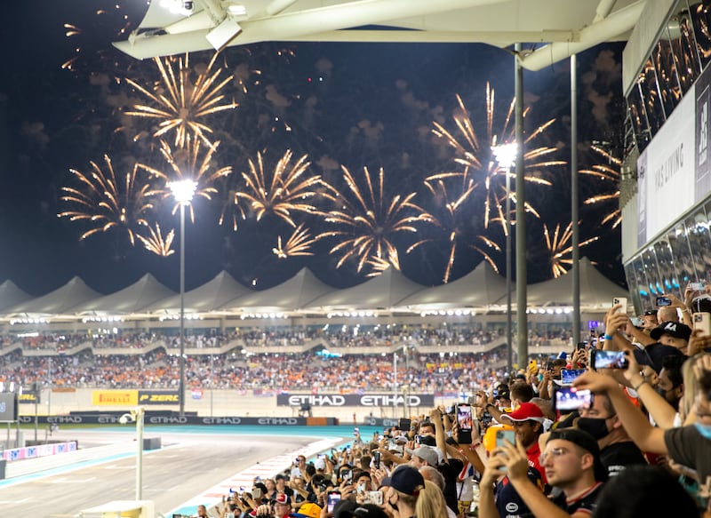 Race fans cheer for 2021 F1 World Drivers Champion Max Verstappen of Netherlands and Red Bull after he takes podium during the F1 Grand Prix of Abu Dhabi at Yas Marina Circuit. Victor Besa/The National.