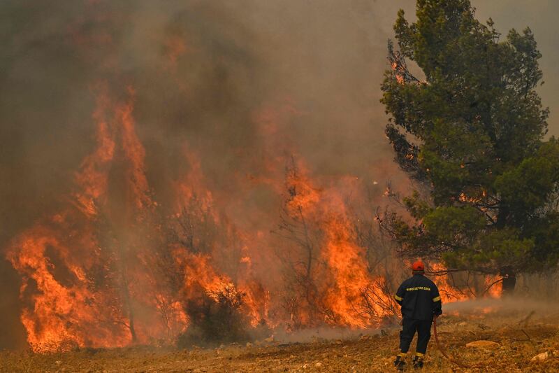 A wildfire in New Peramos, near Athens. AFP