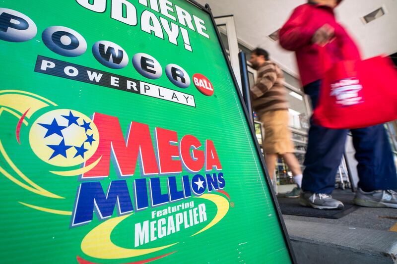 epa07102567 An advertisement for Mega Millions, a 44-state lottery with a record jackpot of nearly one billion US dollars, outside a grocery store in Washington, DC, USA, 18 October 2018. Friday's Mega Millions drawing will be the second largest lottery jackpot in US history.  EPA/JIM LO SCALZO