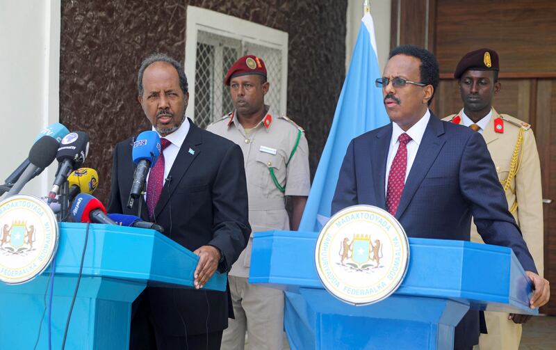 From left, Hassan Sheikh Mohamud takes over from Mohamed Abdullahi Mohamed at the Somalian presidential handover ceremony in May last year. Reuters