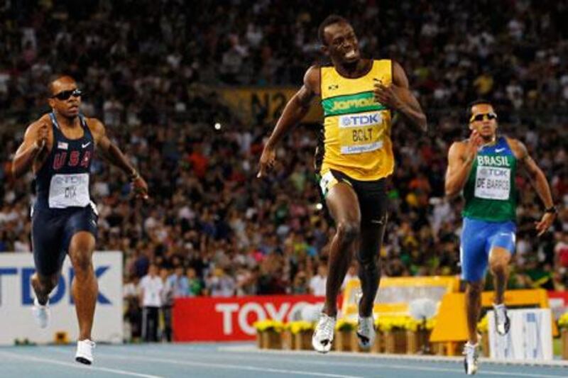 Jamaica's Usain Bolt, centre, finished comfortably ahead of silver medalist Walter Dix, left, of the United States.