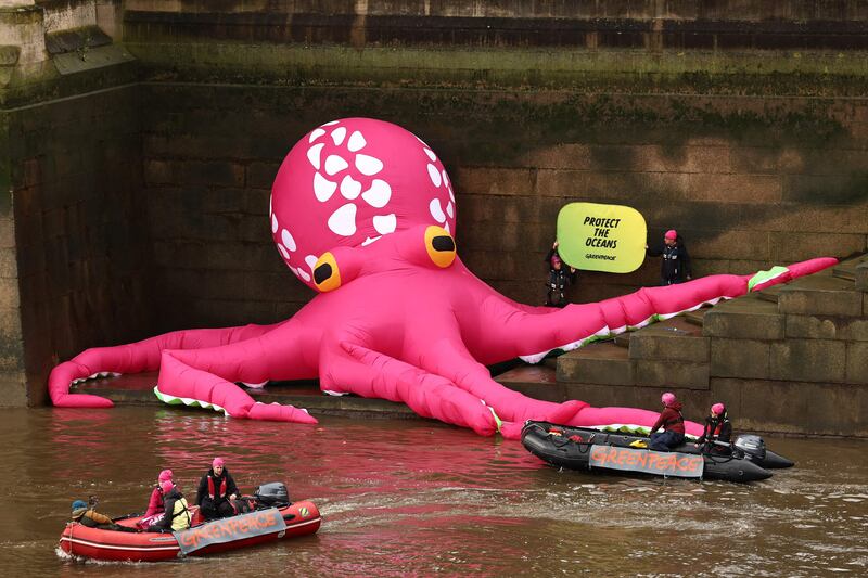 A giant inflatable Octopus is pictured on the bank of the River Thames by Greenpeace as part of a campaign to protect the oceans, London. AFP