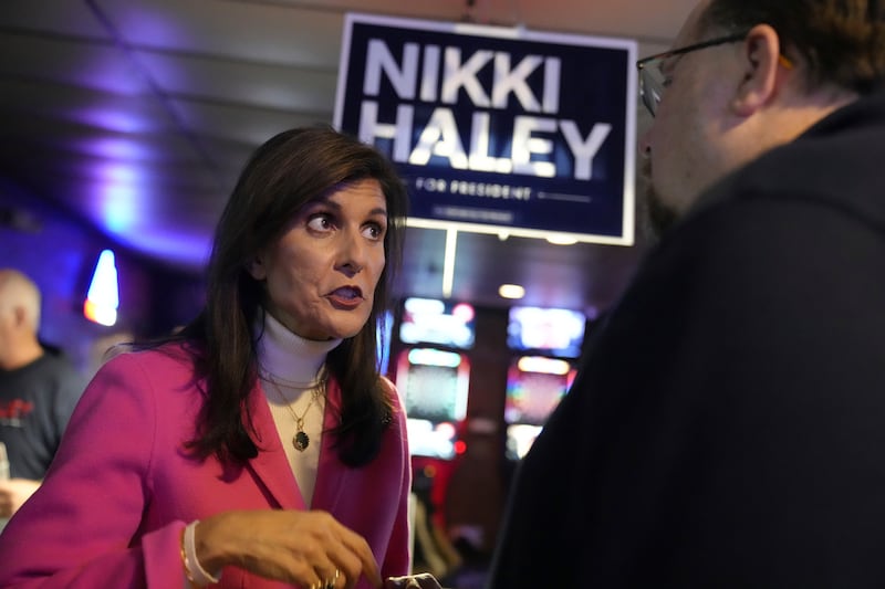 Ms Haley tries to win over a voter after speaking during one of her final stops before Iowa's Republican caucus in Newton. AP