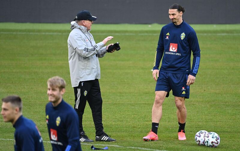 Sweden's Zlatan Ibrahimovic talks with manager Janne Andersson. AFP