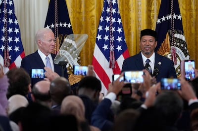 US President Joe Biden listens as Talib M Shareef, Imam of Masjid Muhammad in Washington during Eid Al Fitr celebrations in Washington in May 2022. AP