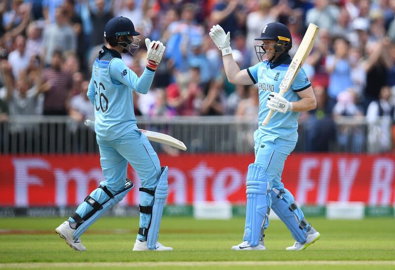 Eoin Morgan celebrates his century with Joe Root. Getty Images