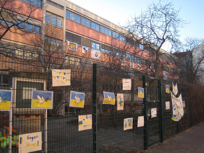 Anti-war banners on the fence of a playschool in Berlin. Daniel Bardsley for The National