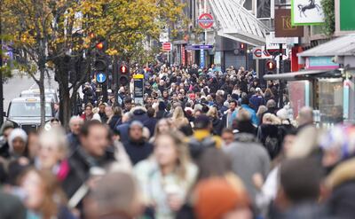 People shopping in Oxford Street, London, but consumer spending across Britain is down. PA