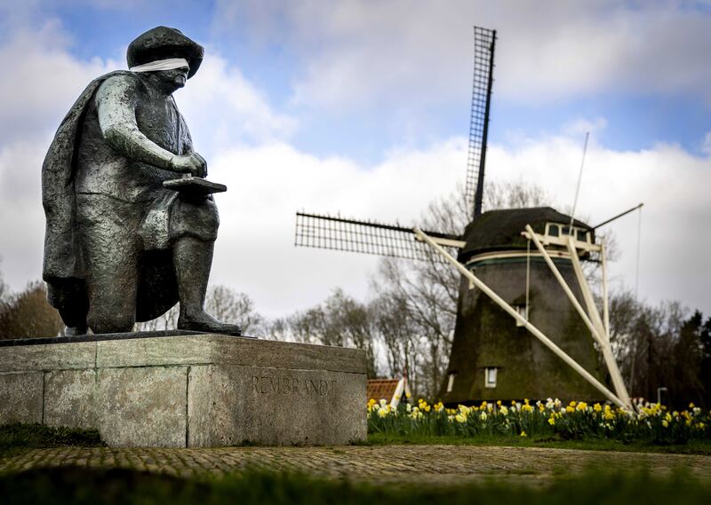A blindfold is placed on the statue of Rembrandt van Rijn in the Netherlands by activists from the Scientist Rebellion environmental group, as part of a campaign to call on those in power not to look away from the climate crisis.  EPA 