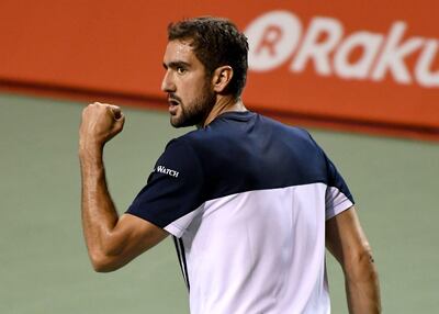 Marin Cilic of Croatia reacts after winning the first set against Ryan Harrison of the US during their men's singles quarter-final match of the Japan Open tennis tournament in Tokyo on October 6, 2017. / AFP PHOTO / Toru YAMANAKA