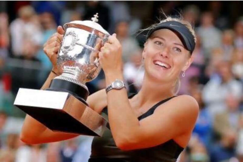 Maria Sharapova, who completed a career grand slam by winning the French Open women's singles title on Saturday, has regained the world No 1 ranking. Michel Euler / AP Photo