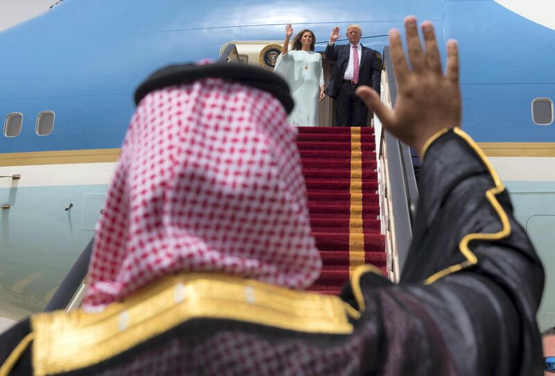 A handout picture provided by the Saudi Royal Palace on May 22, 2017, shows US President Donald Trump and First Lady Melania Trump waving as they board Air Force One before leaving Riyadh to Israel. (Photo by BANDAR AL-JALOUD / Saudi Royal Palace / AFP) / RESTRICTED TO EDITORIAL USE - MANDATORY CREDIT "AFP PHOTO / SAUDI ROYAL PALACE / BANDAR AL-JALOUD" - NO MARKETING - NO ADVERTISING CAMPAIGNS - DISTRIBUTED AS A SERVICE TO CLIENTS