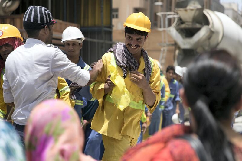 DUBAI, UNITED ARAB EMIRATES - MAY 28, 2018. 

The Ramadan Sharing Fridges initiative in Dubai, distributes meals to construction workers in Bur Dubai.

(Photo by Reem Mohammed/The National)

Reporter: Nawal Al Ramahi
Section: NA