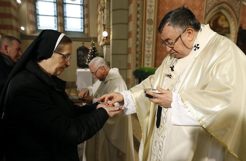 Bosnian Cardinal Vinko Puljic (R) leads the Christmas Day service at the Cathedral of the Heart of Jesus in Sarajevo, Bosnia and Herzegovina.  EPA/FEHIM DEMIR