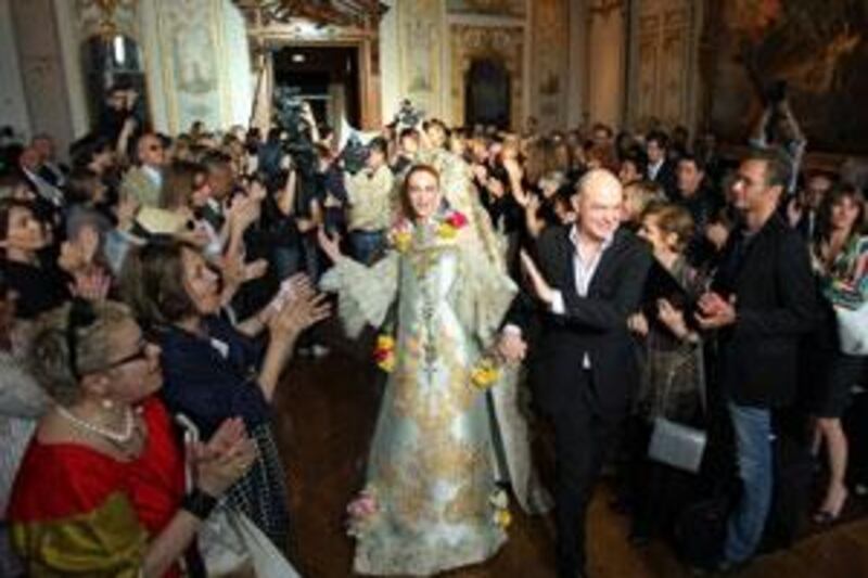 French designer Christian Lacroix acknowledges the audience at the finale of his 2009/2010 Autumn-Winter Haute Couture collection show in Paris in July 2009.