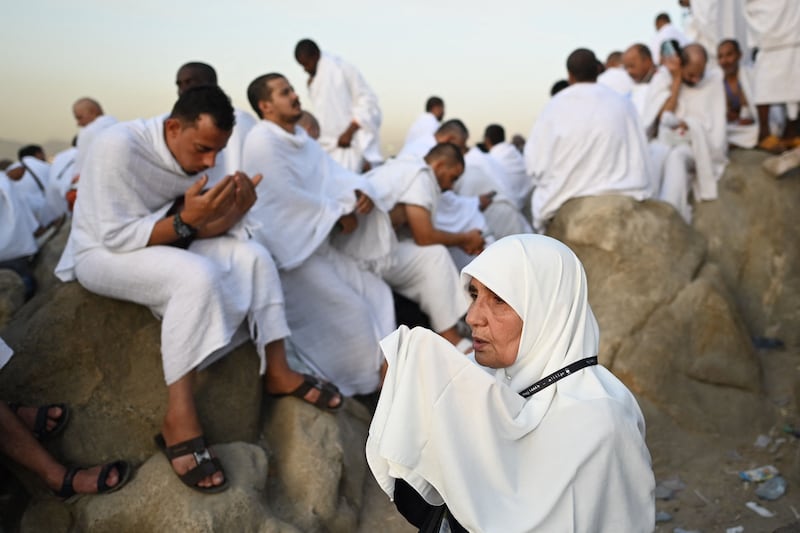 Pilgrims pray atop Mount Arafat. AFP
