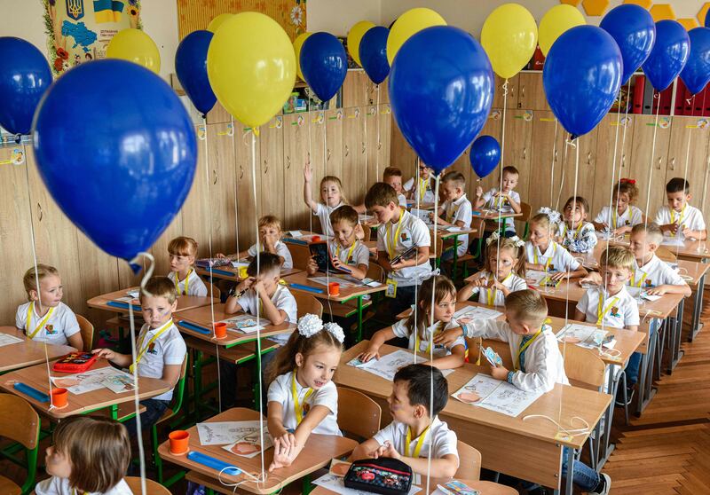 First-grade pupils at the first lesson of the new school year in the western Ukrainian city of Lviv. Ukrainian authorities said 2,199 educational institutions had been damaged by bombing and shelling, with 225 of them completely destroyed. Half of the 23,000 schools surveyed by the education ministry are equipped with bunker facilities necessary to begin classes offline. AFP