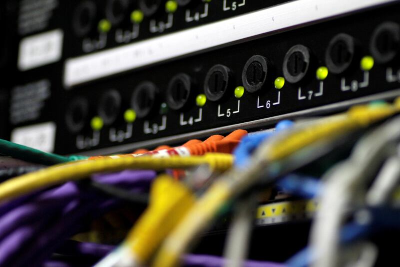 FILE PHOTO: LAN network cables plugged into a computer server in Singapore July 26, 2017.   REUTERS/Thomas White/File Photo