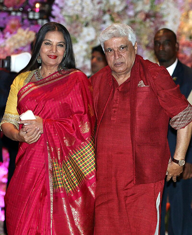 Indian poet, lyricist and screenwriter Javed Akhtar and wife and actress Shabana Azmi pose for a picture as they attend the pre-engagement party of India's richest man and Reliance Industries Limited Chairman, Mukesh Ambani’s eldest son Akash Ambani and fiancee Shloka Mehta, in Mumbai late on June 30, 2018.  / AFP / Sujit Jaiswal
