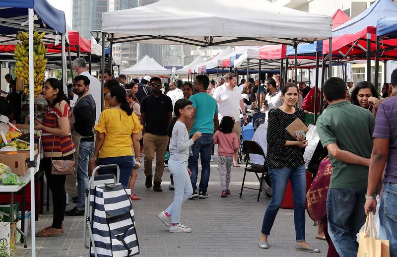 DUBAI , UNITED ARAB EMIRATES , January 18 – 2019 :- People buying vegetable , fruits and other organic items at the Farmers Market held at the Bay Avenue in Business Bay in Dubai. (Pawan Singh / The National ) For News/Online/Instagram. Story by Patrick