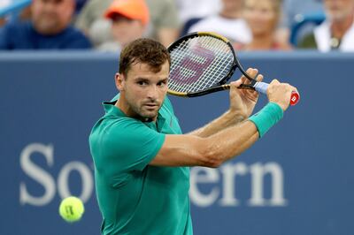 MASON, OH - AUGUST 16: Grigor Dimitrov of Bulgaria returns a shot to Novak Djokovic of Serbia during the Western & Southern Open at Lindner Family Tennis Center on August 16, 2018 in Mason, Ohio.   Matthew Stockman/Getty Images/AFP
== FOR NEWSPAPERS, INTERNET, TELCOS & TELEVISION USE ONLY ==
