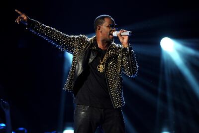 FILE- In this June 30, 2013, file photo R. Kelly performs onstage at the BET Awards at the Nokia Theatre in Los Angeles. R. Kelly, the R&B star who has been trailed for decades by allegations that he violated underage girls and women and held some as virtual slaves, was charged Friday, Feb. 22, 2019, with aggravated sexual abuse involving four victims, including at least three between the ages of 13 and 17. (Photo by Frank Micelotta/Invision/AP)