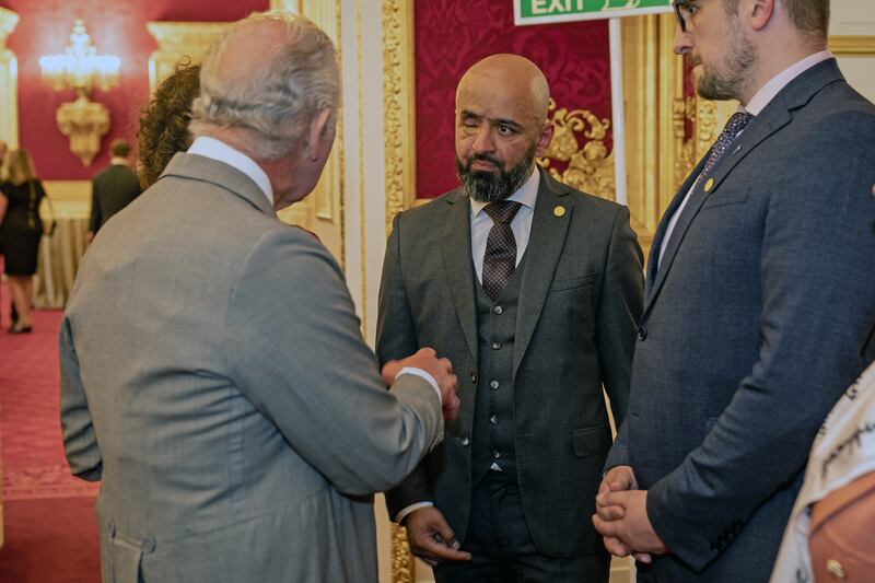 King Charles meets Masi Nayyen, an Afghan-Ukrainian journalist, MP and lecturer, during the reception. PA