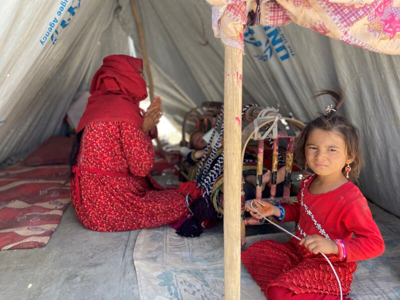 Young girls pass the time at a camp for internally displaced people, administered by the United Nations High Commission for Refugees in northern Afghanistan. Photo: Ruchi Kumar for The National.