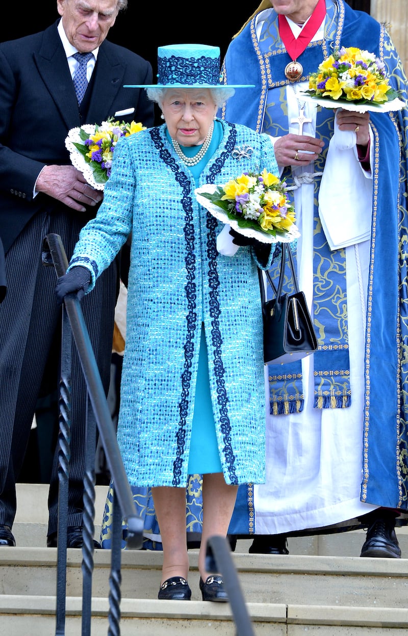Queen Elizabeth II, wearing blue, attends the traditional Royal Maundy Service at Windsor Castle on March 24, 2016. Getty Images
