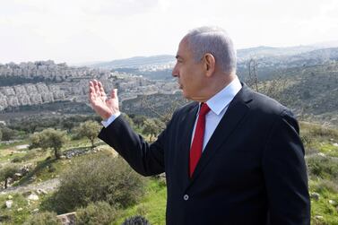 Israeli Prime Minister Benjamin Netanyahu gestures overlooking the Israeli settlement of Har Homa, in the Israeli-occupied West Bank, that Israel annexed to Jerusalem after the region's capture in the 1967 Arab-Israeli war, February 20, 2020. Reuters