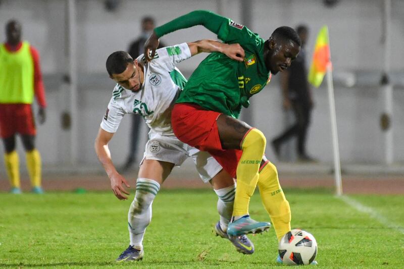 Cameroon midfielder Martin Hongla under pressure from Algeria's Ismail Bennacer. AFP