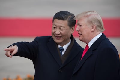 (FILES) In this file photo taken on November 08, 2017 China's President Xi Jinping (L) and US President Donald Trump attend a welcome ceremony at the Great Hall of the People in Beijing.  The new partial trade agreement between the United States and China will be signed in the middle of next month in Washington, US President Donald Trump said on December 31, 2019.
"I will be signing our very large and comprehensive Phase One Trade Deal with China on January 15," Trump tweeted moments before Wall Street was due to open.
"The ceremony will take place at the White House. High level representatives of China will be present."
Trump said he would then travel to Beijing to continue negotiations "at a later date."
 / AFP / NICOLAS ASFOURI
