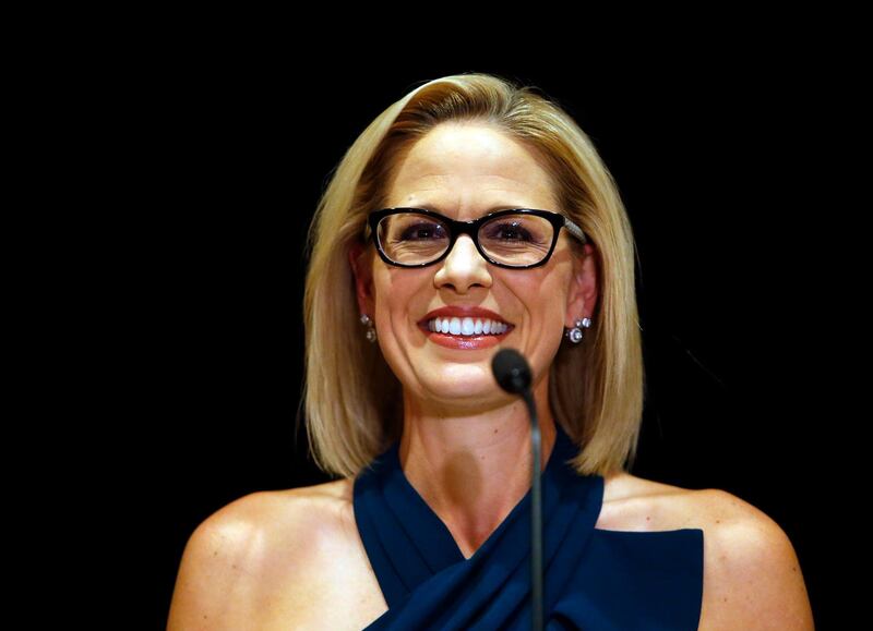 U.S. Sen.-elect Kyrsten Sinema, D-Ariz., smiles after her victory over Republican challenger U.S. Rep. Martha McSally, Monday, Nov. 12, 2018, in Scottsdale, Ariz. Sinema won Arizona's open U.S. Senate seat in a race that was among the most closely watched in the nation, beating McSally in the battle to replace GOP Sen. Jeff Flake. (AP Photo/Rick Scuteri)