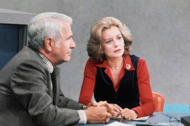 Walters on the ABC evening news with anchor partner Harry Reasoner in October 1976. AP Photo