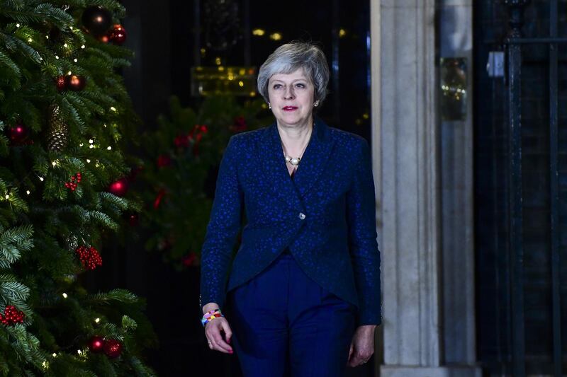 Theresa May, U.K. prime minister, walks out to deliver a statement outside number 10 Downing Street in London, U.K., on Wednesday, Dec. 12, 2018. May survived an attempt to oust her as U.K. prime minister on Wednesday, but the size of the rebellion against her weakens her position at a critical time as she tries to steer the U.K. out of the European Union. Photographer: Chris J. Ratcliffe/Bloomberg
