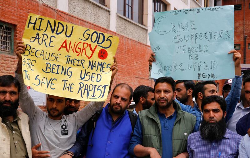 epa06668194 People hold placards during a protest calling for justice in the rape and murder case of eight-year-old girl, in Srinagar, the summer capital of Indian Kashmir, 14 April 2018. According to Police, the nomadic Gujjar child was raped and murdered in Kathua district of Jammu region in January 2018. The Crime Branch of Police has filed a charge sheet of the case in a local court and indicted eight people in the case.  EPA/FAROOQ KHAN