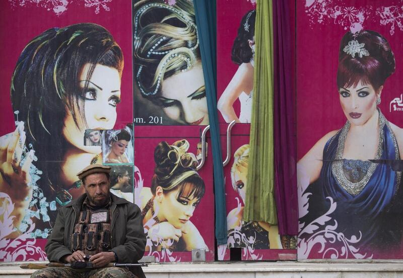 Even this hair salon in Kabul needs a security guard.