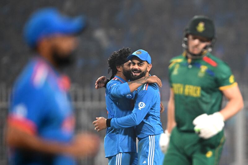 India's Ravindra Jadeja celebrates with Virat Kohli after taking the wicket of South Africa's David Miller during their World Cup match at the Eden Gardens in Kolkata on Sunday, November 5, 2023. AFP