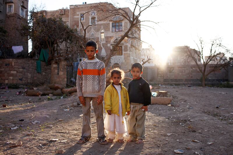 SANA'A, YEMEN - February 2, 2010: Siblings (left to right) Hamad, Noura, 6, and Mohamed, 7, stand for a photograph in a vacant lot behind their home in the old city of Sana'a. Yemen is the 3rd most malnourished country in the world, where 58 percent of the population suffers from malnourishment and 45 percent of the population lives below the poverty line. ( Ryan Carter / The National )

*** for story by Nugh Naylor ***