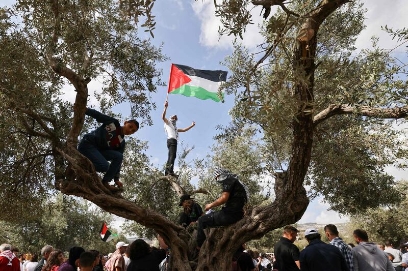 An Arab Israeli protester waves the Palestinian flag in Sakhnin, in northern Israel, ahead of the 74th anniversary of the Nakba – "catastrophe" in Arabic. This marks the forced removal of Palestinians from their homes after the formation of Israel  1948. AFP