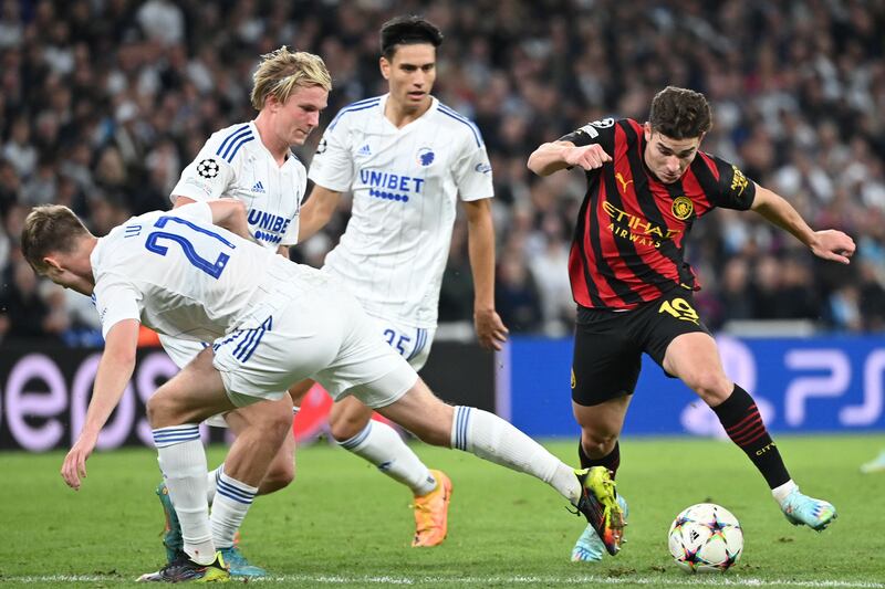 FC Copenhagen defender Valdemar Lund Jensen, left, attempts to tackle Manchester City striker Julian Alvarez. AFP